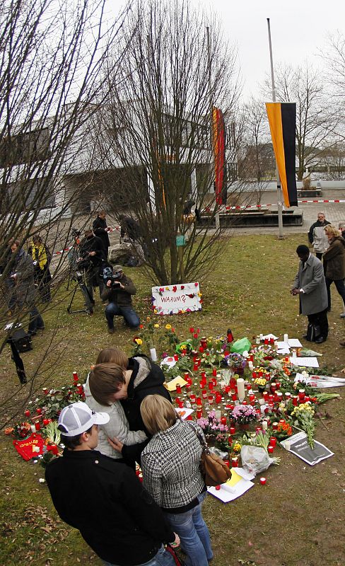 Students mourn at the Albertville-Realschule school where a shooting incident took place in Winnenden