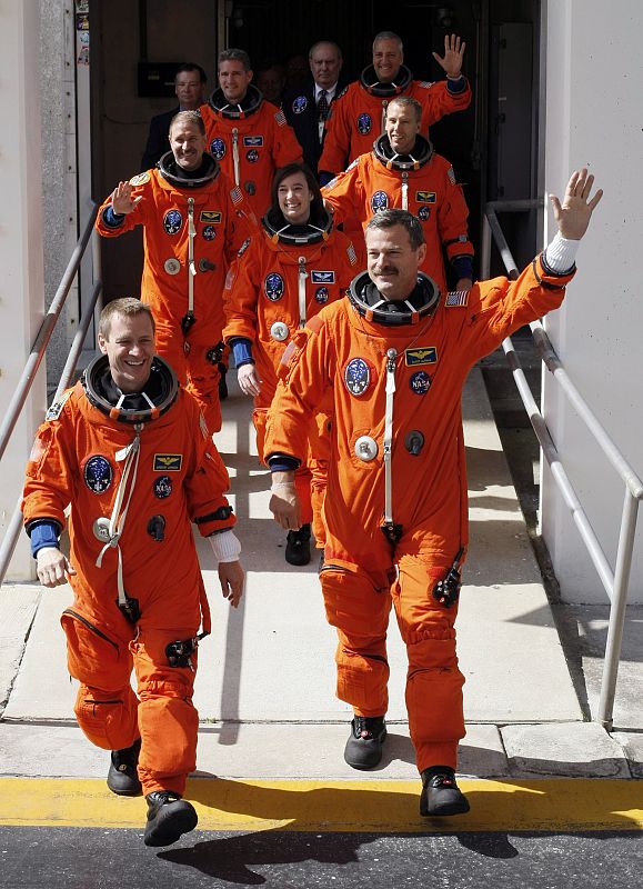 The crew of the space shuttle Atlantis departs crew quarters for launch pad 39A at the Kennedy Space Center in Cape Canaveral