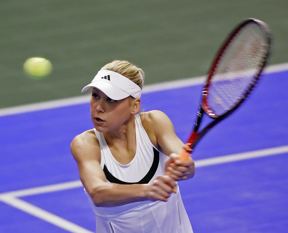 Anna Kournikova returns a shot at the Frisco Pro Celebrity Class tennis match in Frisco, Texas