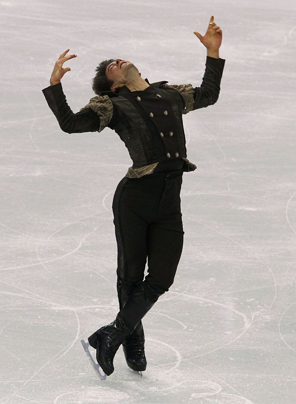 Lambiel of Switzerland performs during the men's figure skating short programme at the Vancouver 2010 Winter Olympics