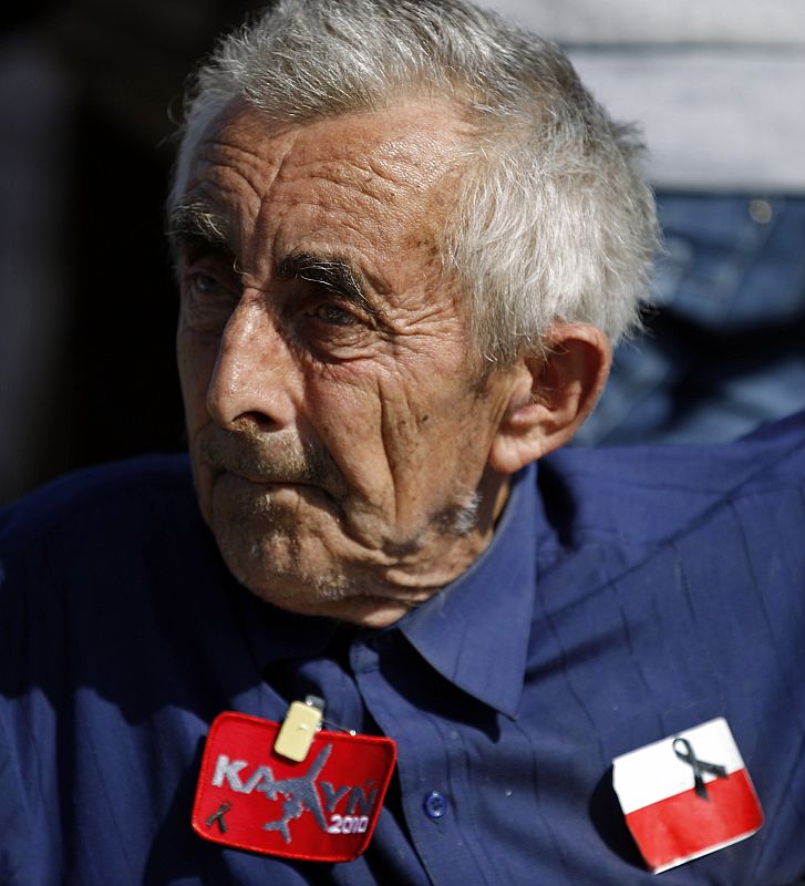 An elderly man waits for the start of a commemoration service for late Polish President Lech Kaczynski and other plane crash victims at the Pilsudski square in Warsaw