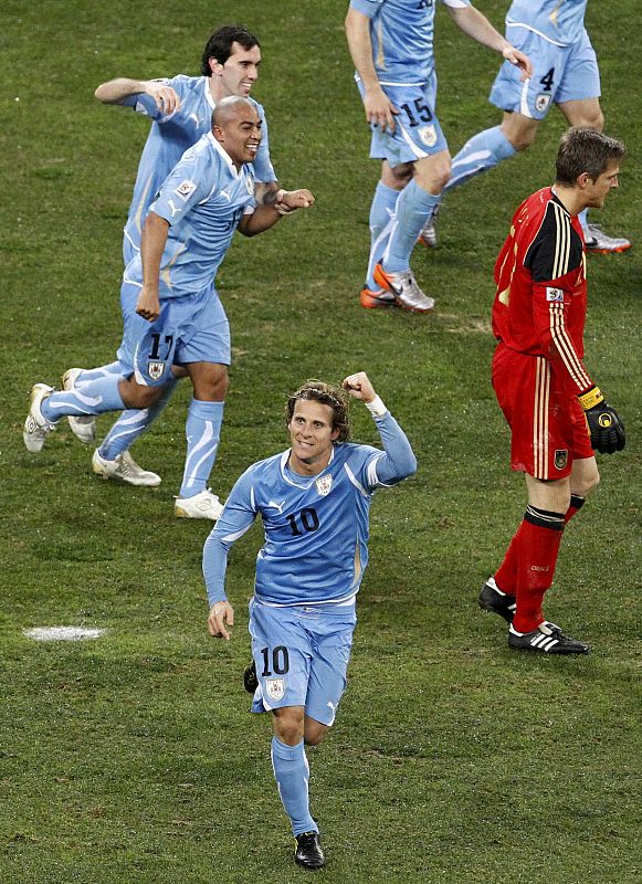 Uruguay's Forlan celebrates after scoring against Germany during their 2010 World Cup third place playoff soccer match in Port Elizabeth