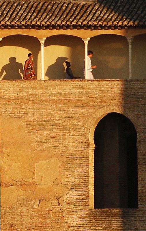 U.S. first lady Obama and her daughter Sasha walk in the Alhambra Palace during their visit to the southern Spanish town of Granada