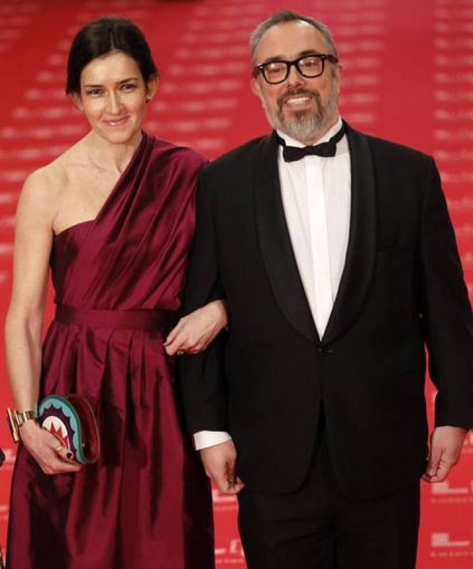 Spanish director and President of the Spanish Film Academy de la Iglesia and Spain's Culture Minister Gonzalez-Sinde pose at Madrid's Royal Theatre