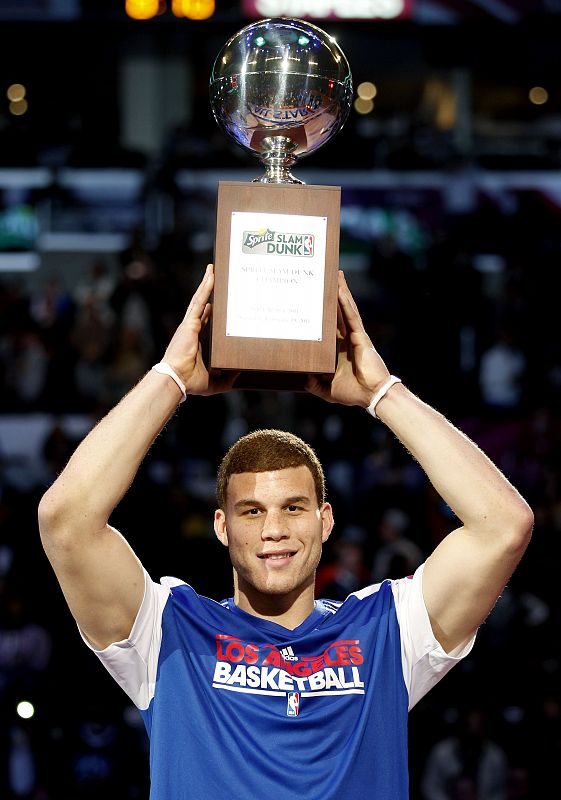 Clippers' Griffin holds the trophy after winning the slam dunk contest during the NBA basketball All Star weekend in Los Angeles