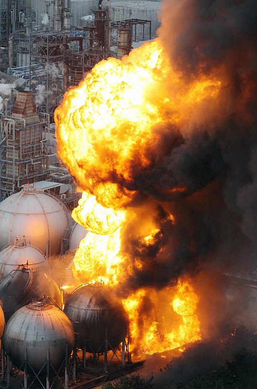 Natural gas storage tanks burn at a facility in Chiba Prefecture, near Tokyo