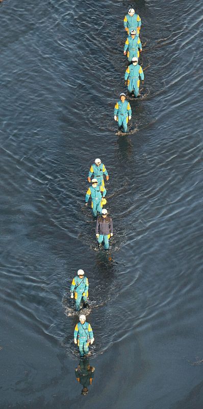 A rescue team searches for missing people in Sendai, northeastern Japan