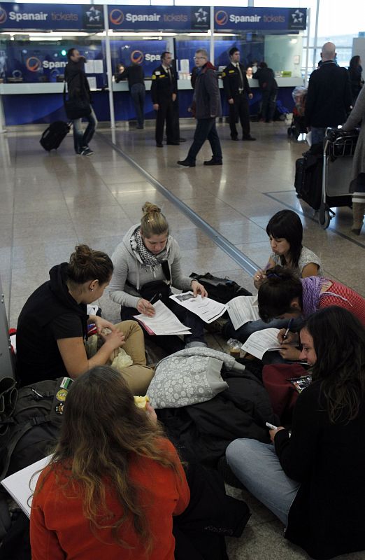 People seek claims at the desk of Spanair at Barcelona's airport