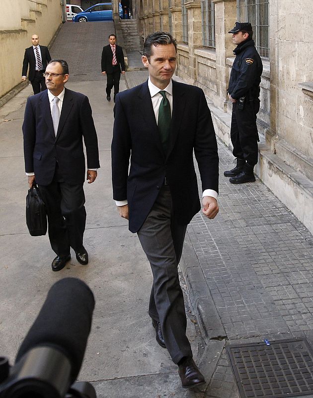 Inaki Urdangarin arrives with his lawyer Vives for questioning over corruption allegations at a court in Palma de Mallorca