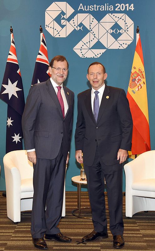El presidente Mariano Rajoy con el primer ministro australiano Tony Abbott (d)