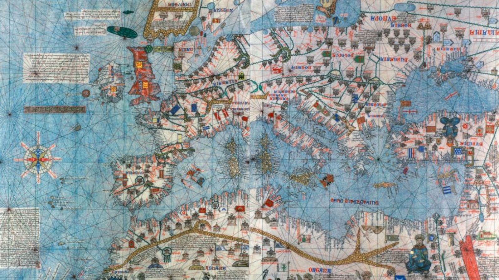 Detalle de un mapa portulano medieval del Atlas Catalán (1375), mostrando costas, ciudades y una rosa de los vientos.  Biblioteca Nacional de Francia.