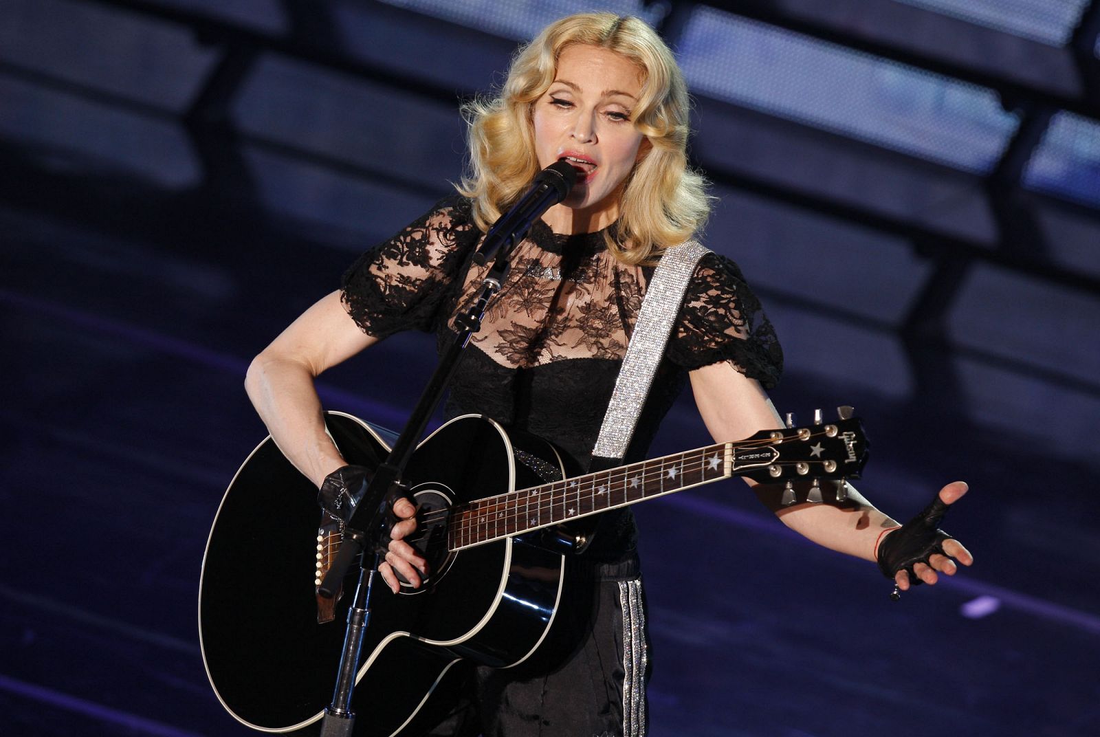 Singer Madonna performs during a concert to celebrate the launch of her new album "Hard Candy" in Paris