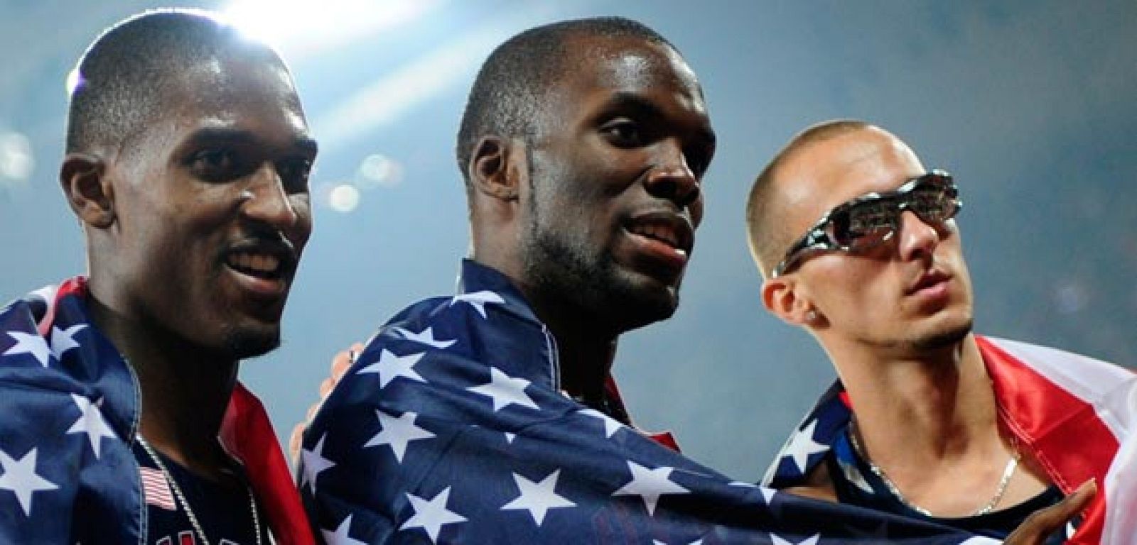 Neville of the U.S. and compatriots Merritt and Wariner celebrate after the men's 400m athletics final in the National Stadium at the Beijing 2008 Olympic Games 