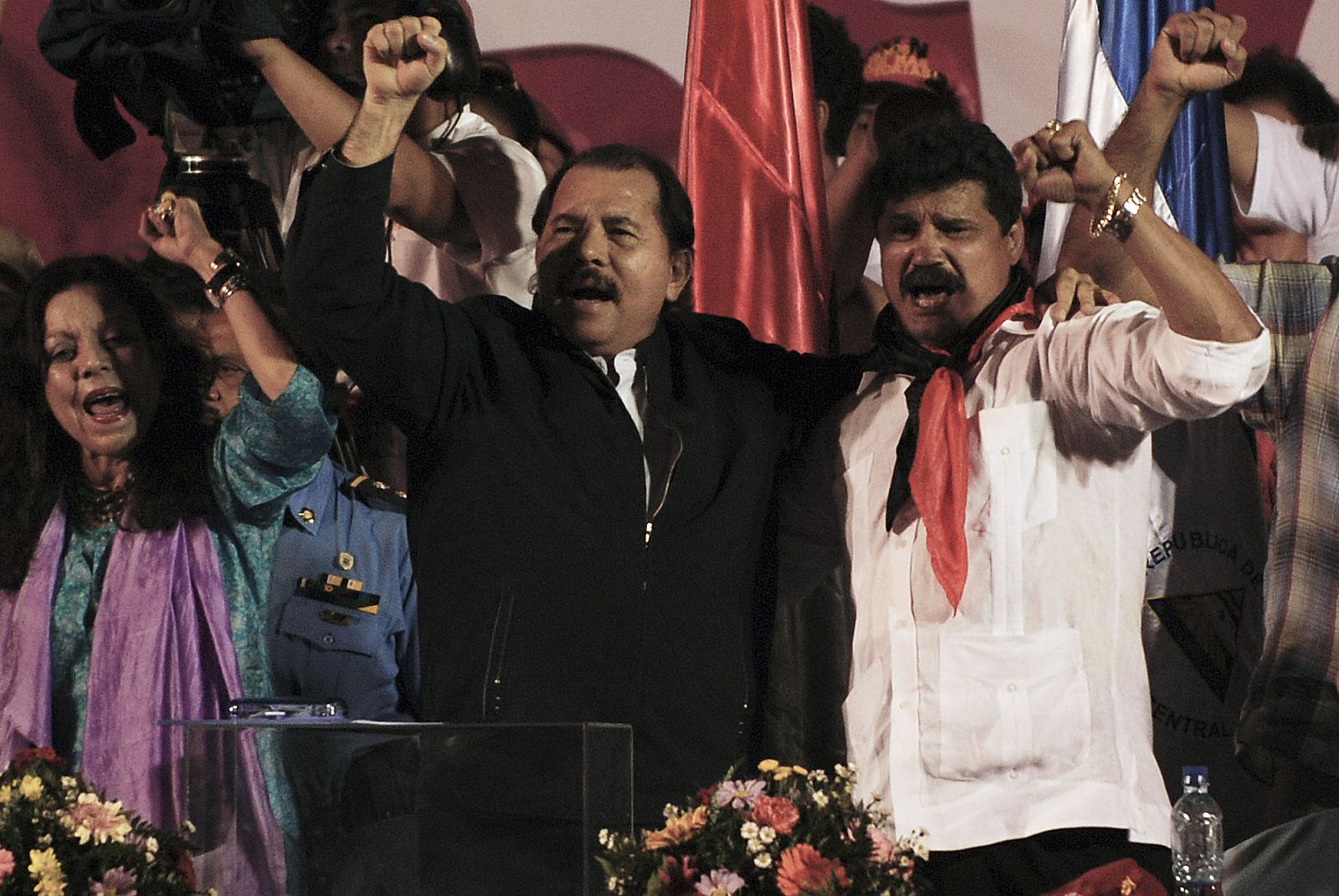 Nicaragua's President Ortega and Managua's new mayor Arguello of the leftist FSLN greet supporters as they celebrate in Managua