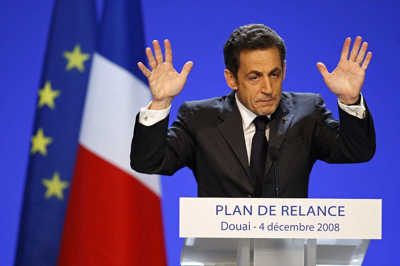 France's President Nicolas Sarkozy announces a 26 billion euro stimulus plan for the faltering economy during a speech in Douai