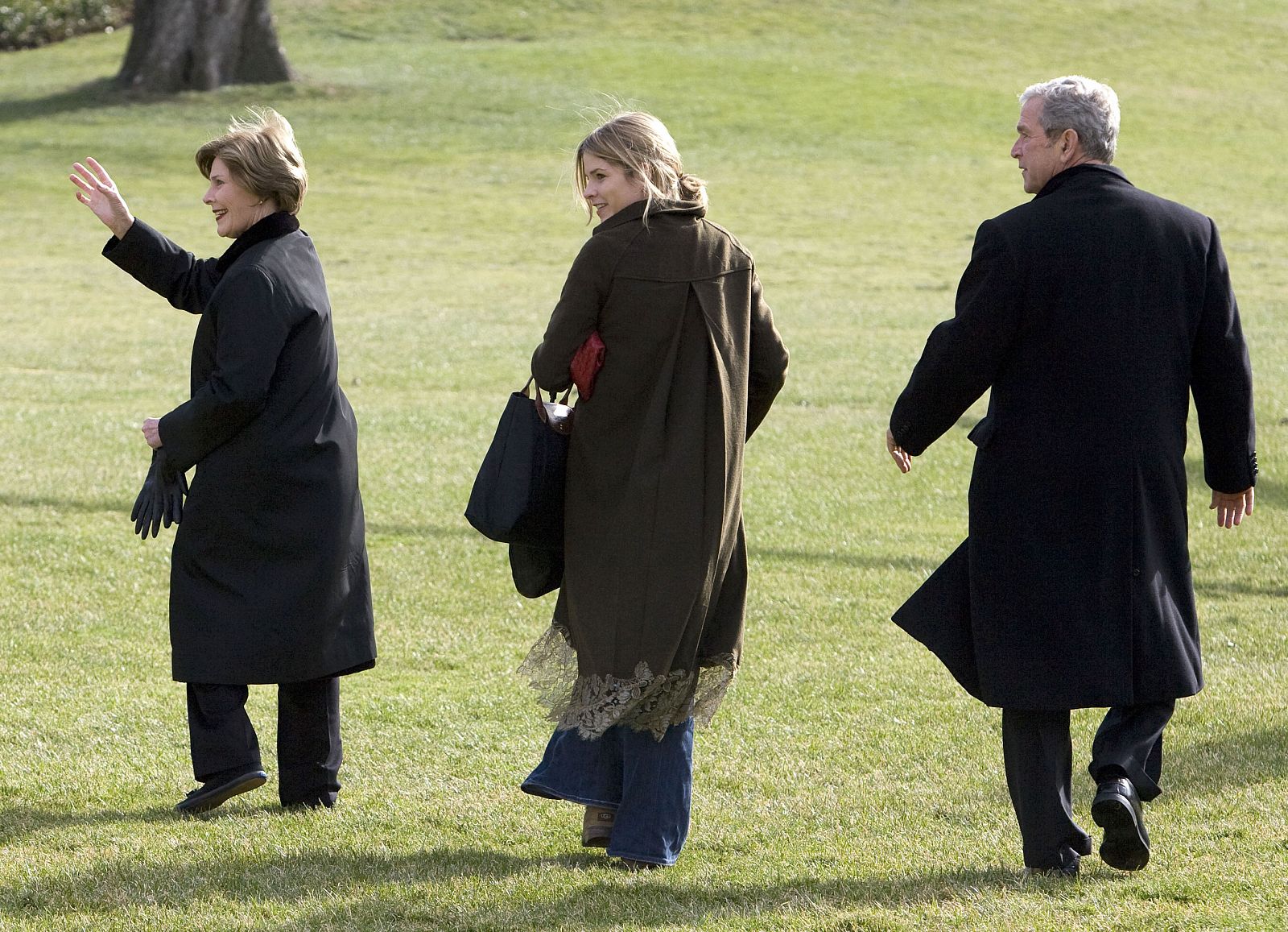 U.S. President Bush waves before departing the White House in Washington