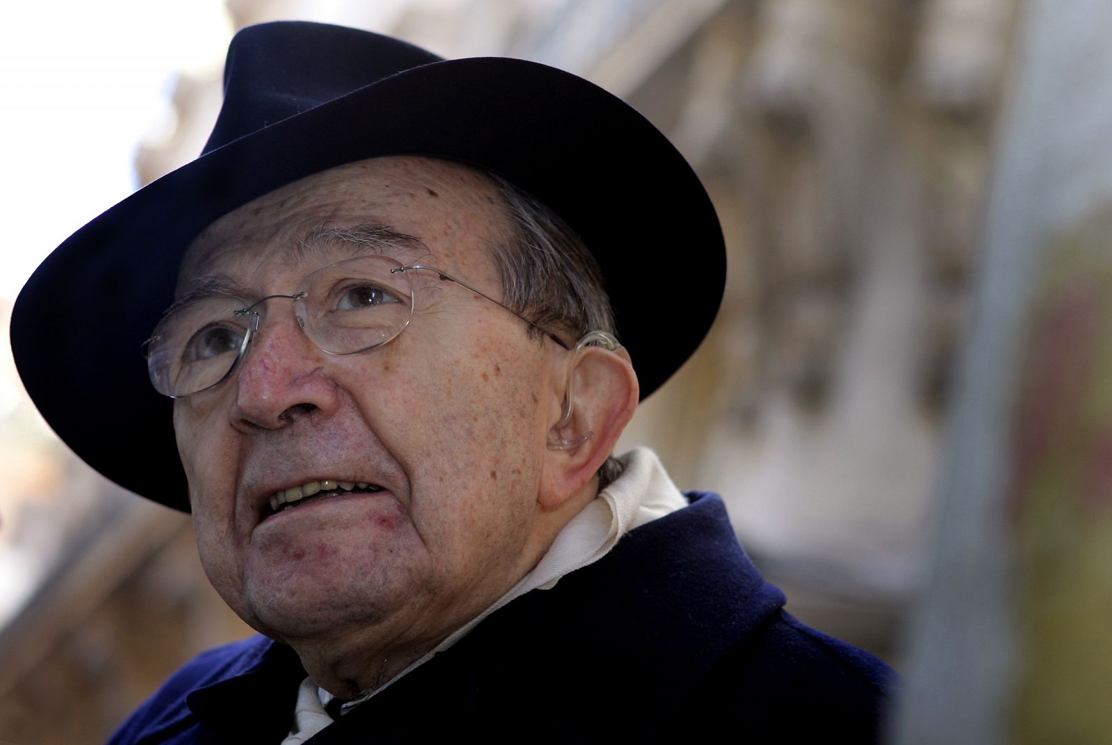 Former Italian Prime Minister Giulio Andreotti leaves at the end of the ceremony of second ...