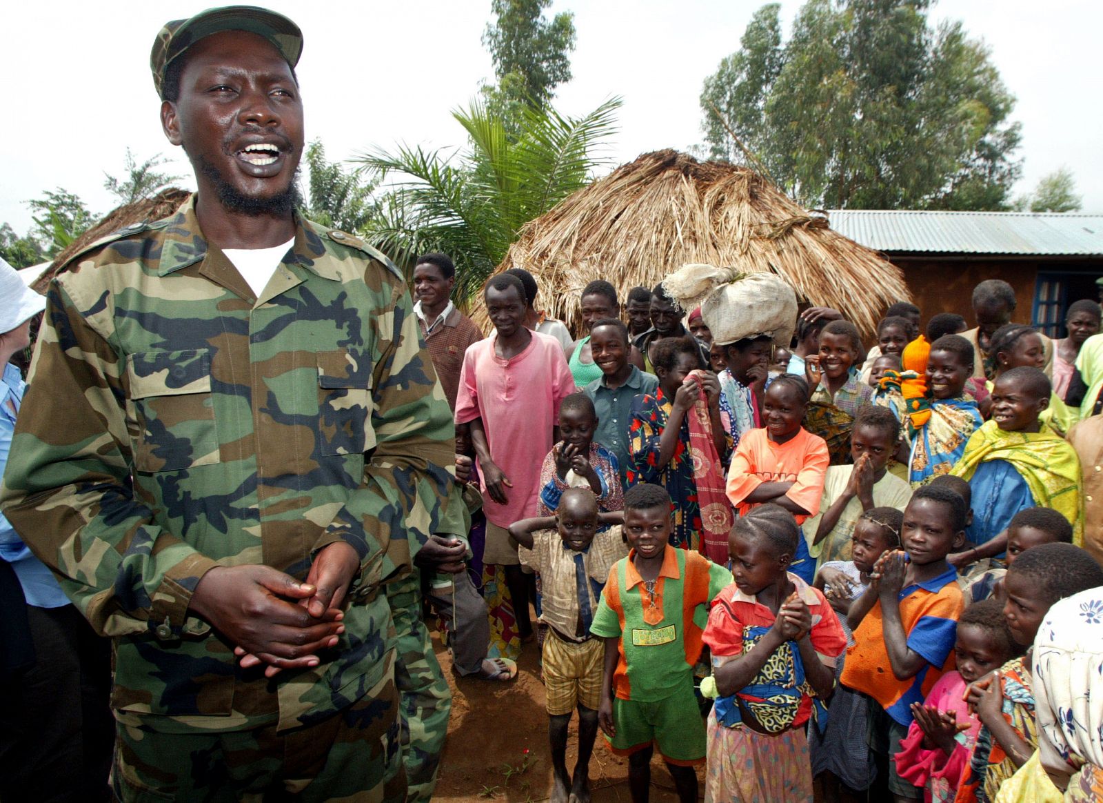 UPC REBEL LEADER THOMAS LUBANGA TALKS TO VILLAGERS ON HIS WAY TO A