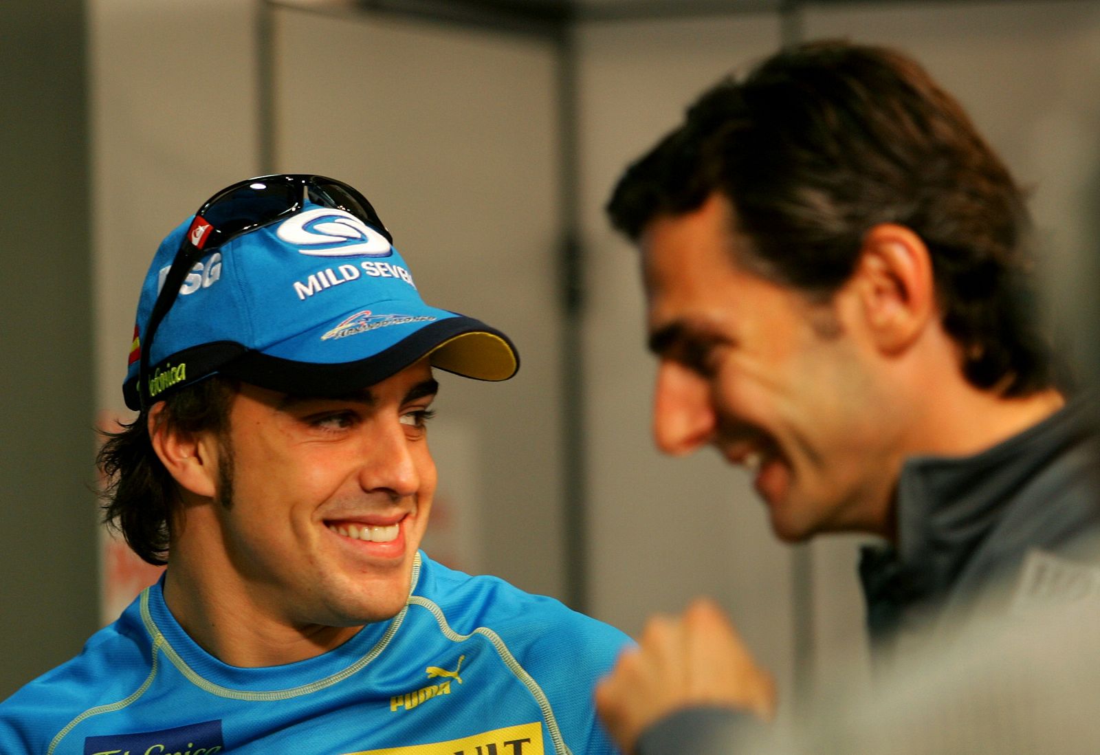 Formula One driver Fernando Alonso from Spain and MacLaren-Mercedes test driver Pedro Martinez de la Rosa attend a news conference at  Catalunya's racetrack near Barcelona