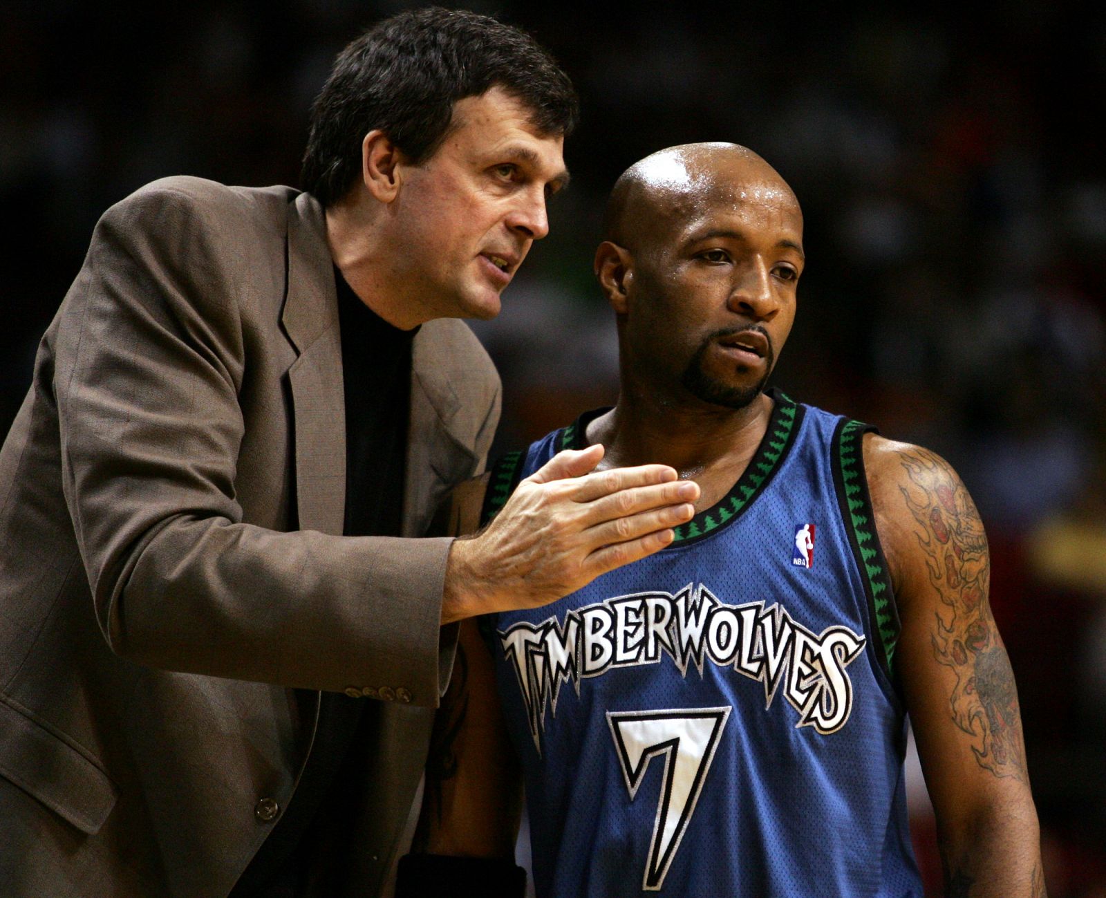 Minnesota's coach McHale talks with Carter during game with Miami in Florida.