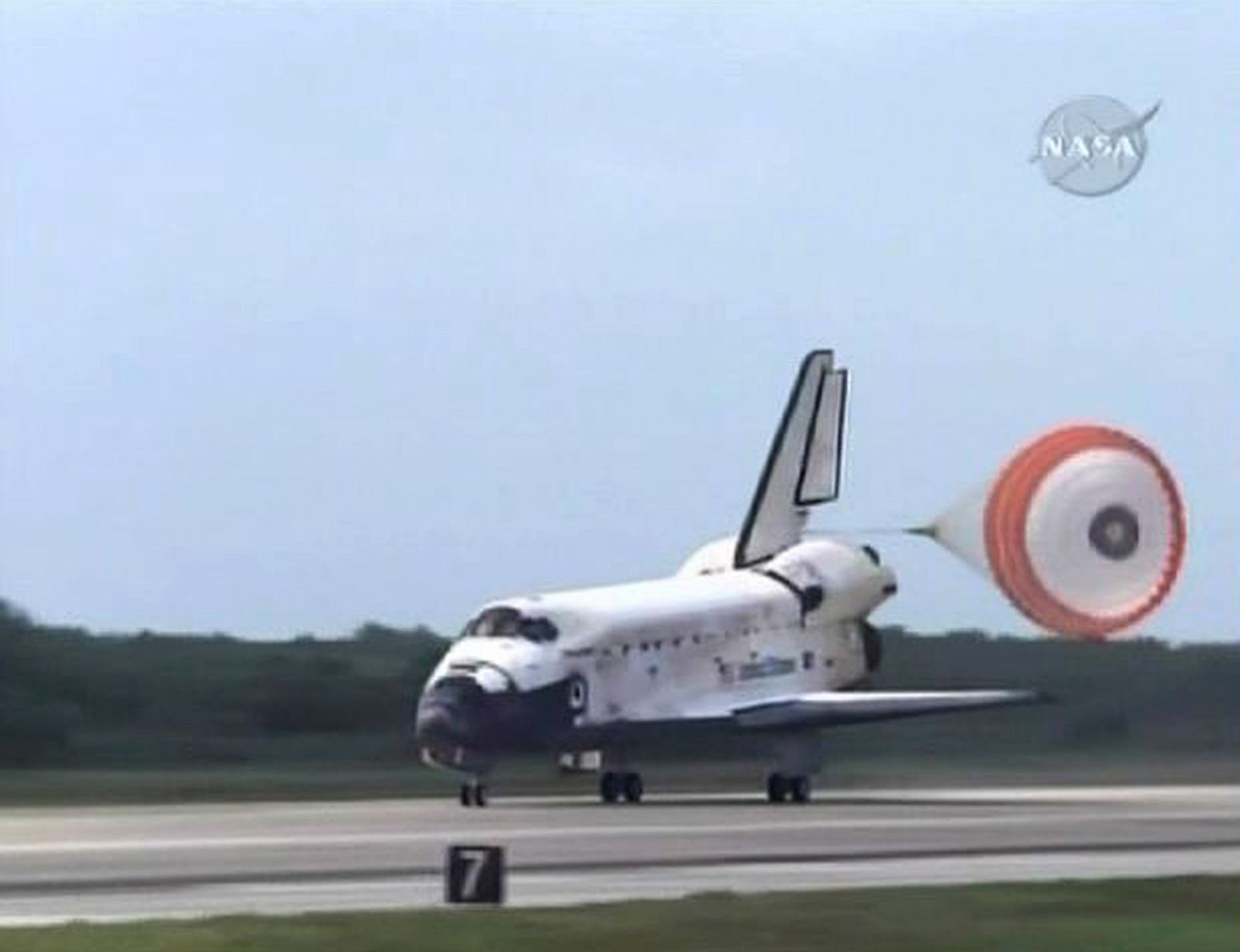 The space shuttle Discovery lands at the Kennedy Space Center in Florida in this image from NASA TV