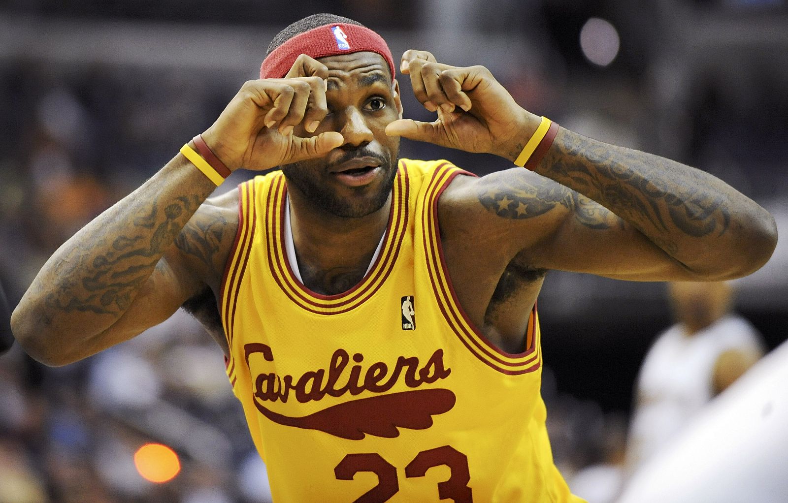 James pretends to take a picture during pregame introductions before their NBA game in Washington