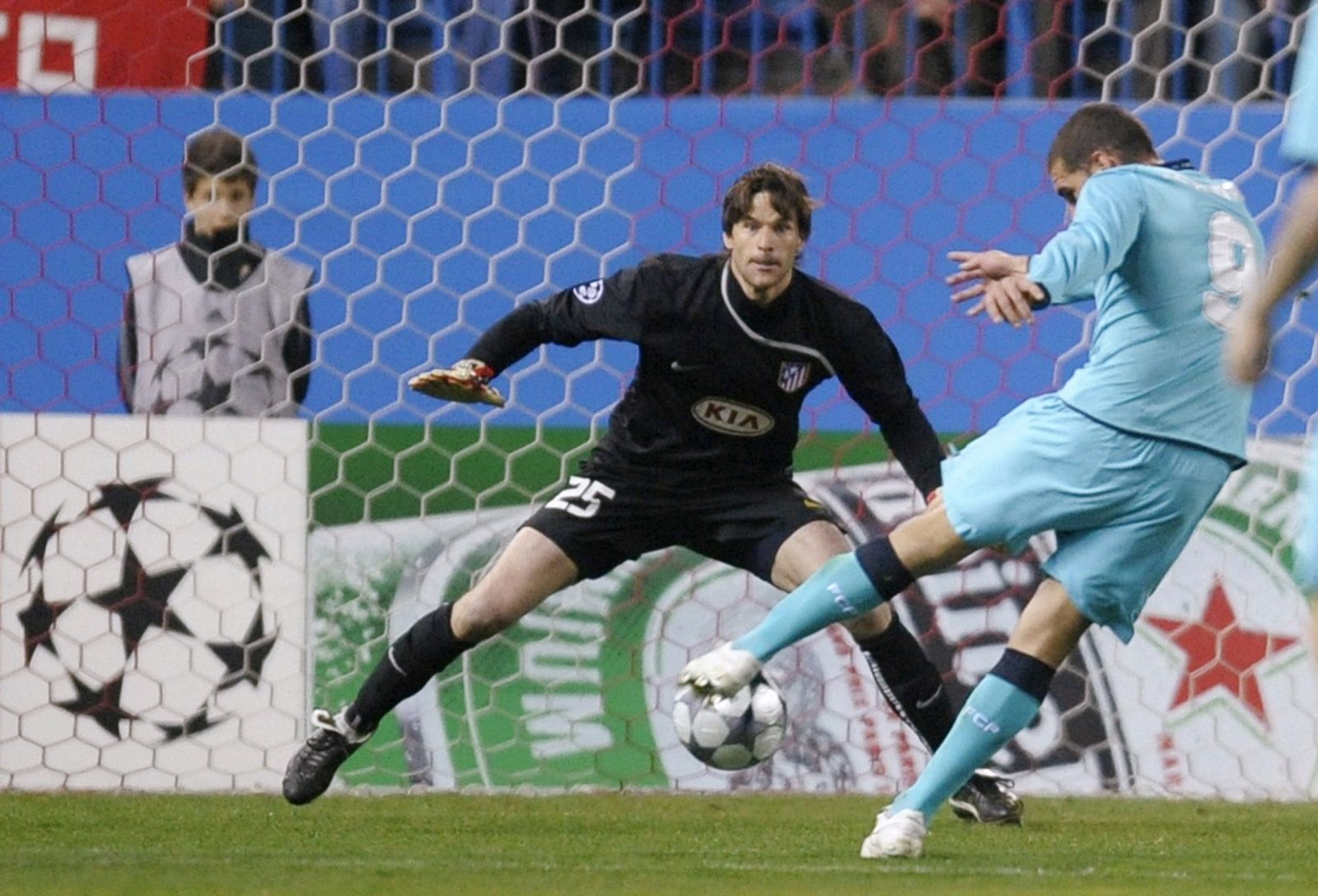 Porto's Lopez kicks to score past Atletico Madrid's goalkeeper Franco during their Champions League match in Madrid