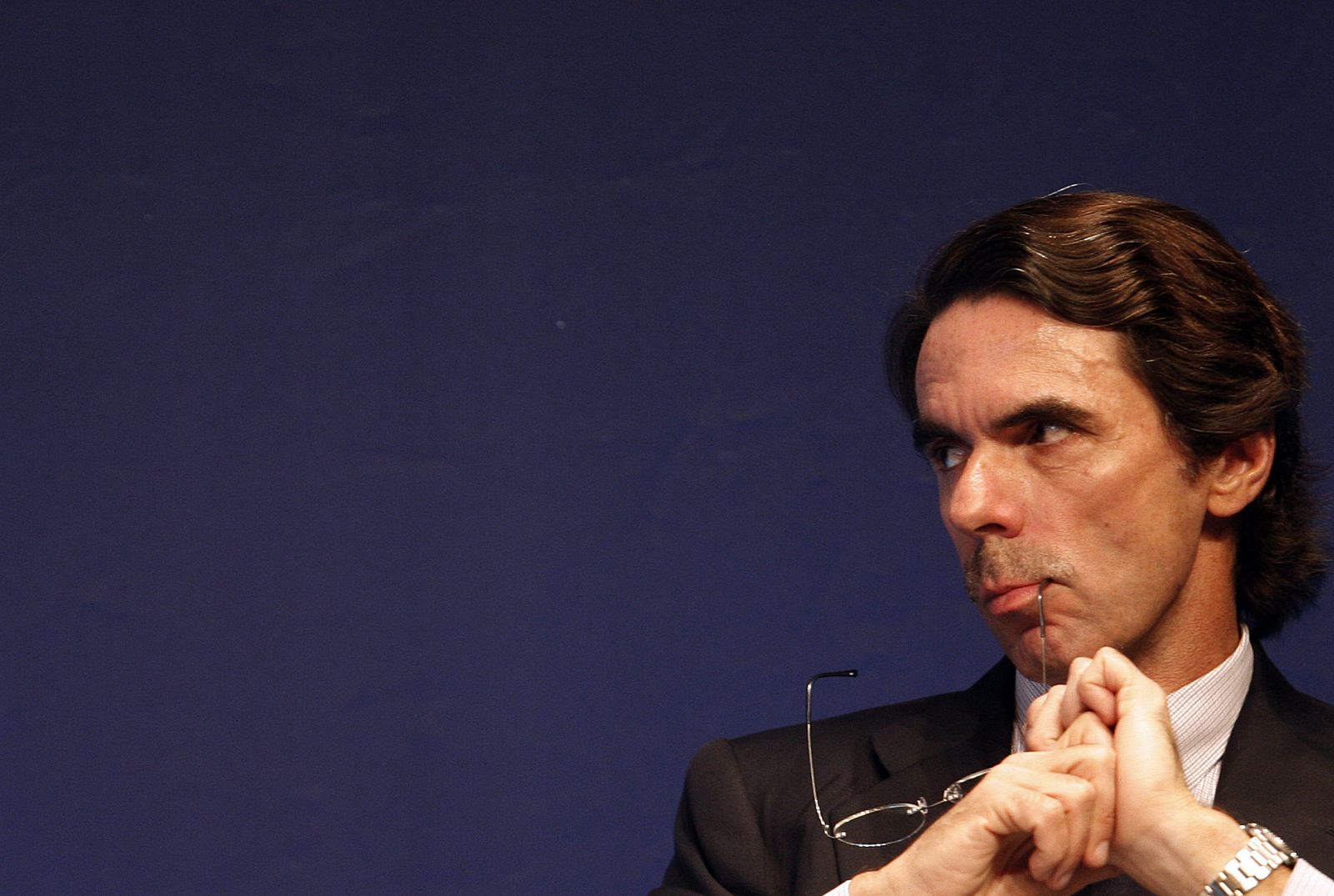 Former Spanish PM Aznar listens to a speaker during a conference on globalization in Estoril, near Lisbon