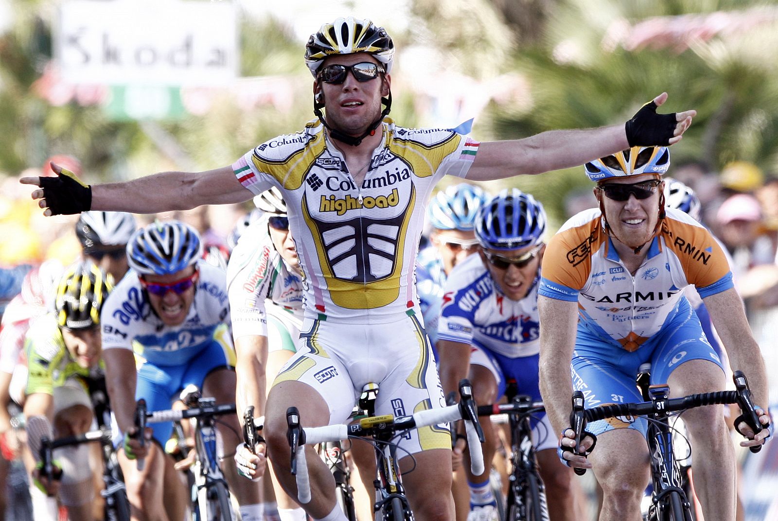 British rider Cavendish celebrates as he crosses the finish line after the eleventh stage of the Giro d'Italia in Arenzano