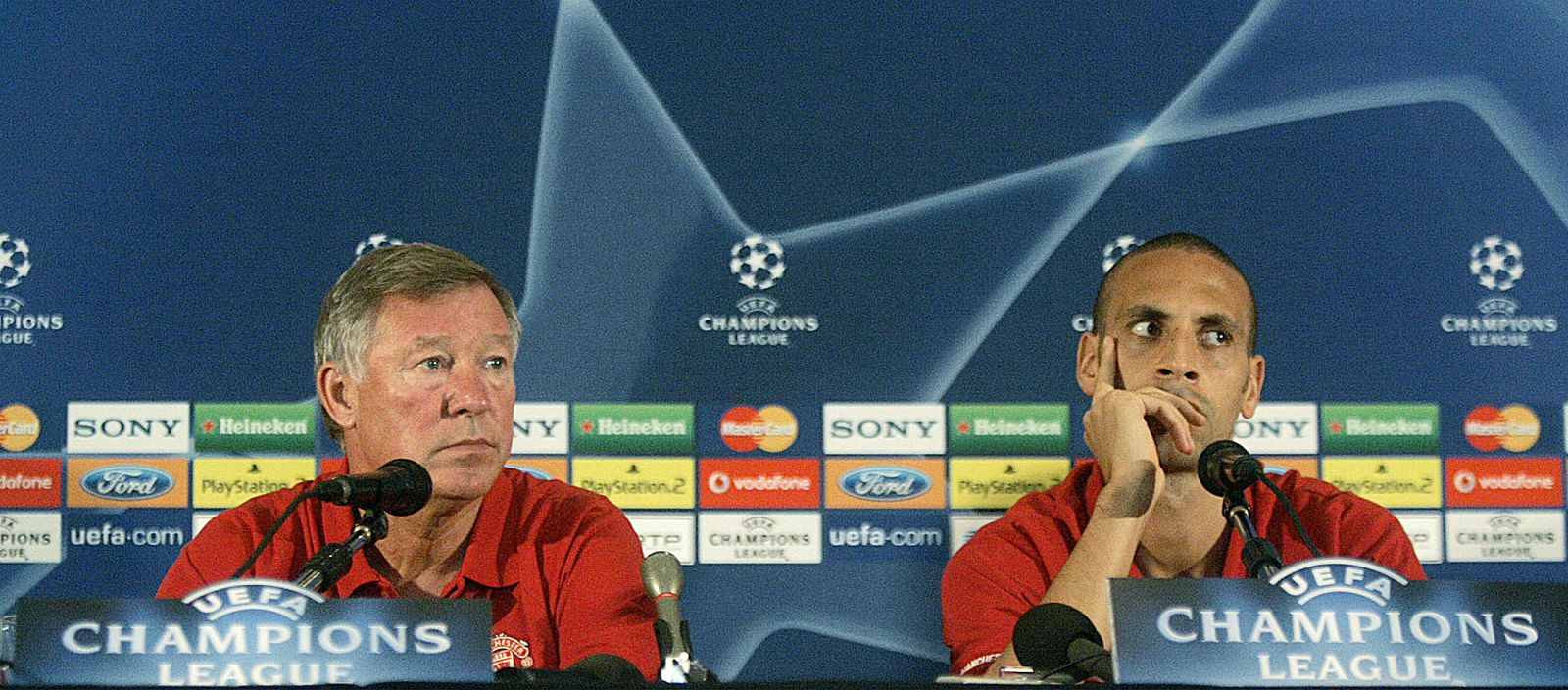 Manchester United's Ferguson and Ferdinand listen to a question during a news conference in Lisbon