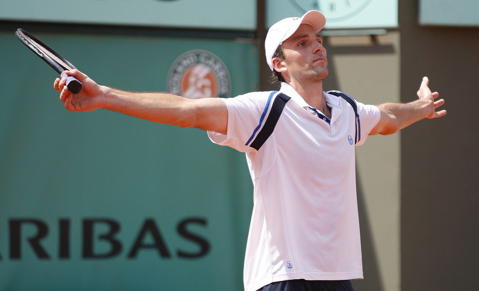 Ivo Karlovic gestures during his match against Lleyton Hewitt at Roland Garros in Paris
