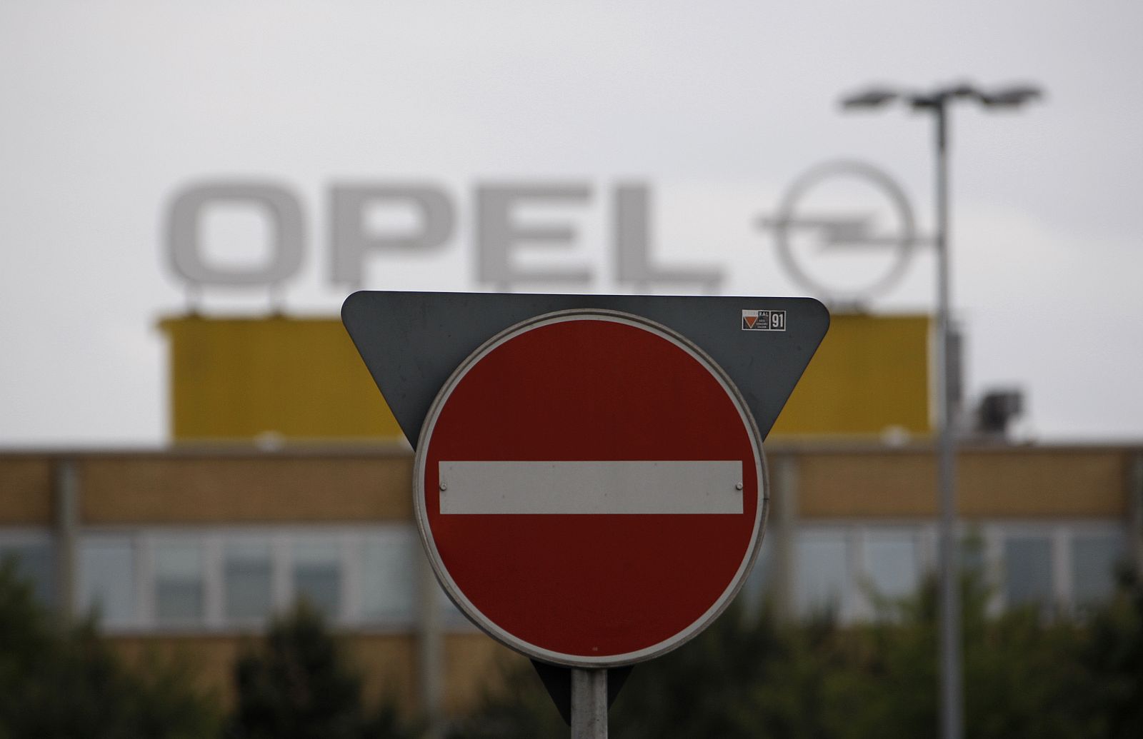 A traffic sign is pictured in front of the Opel plant in Kaiserslautern