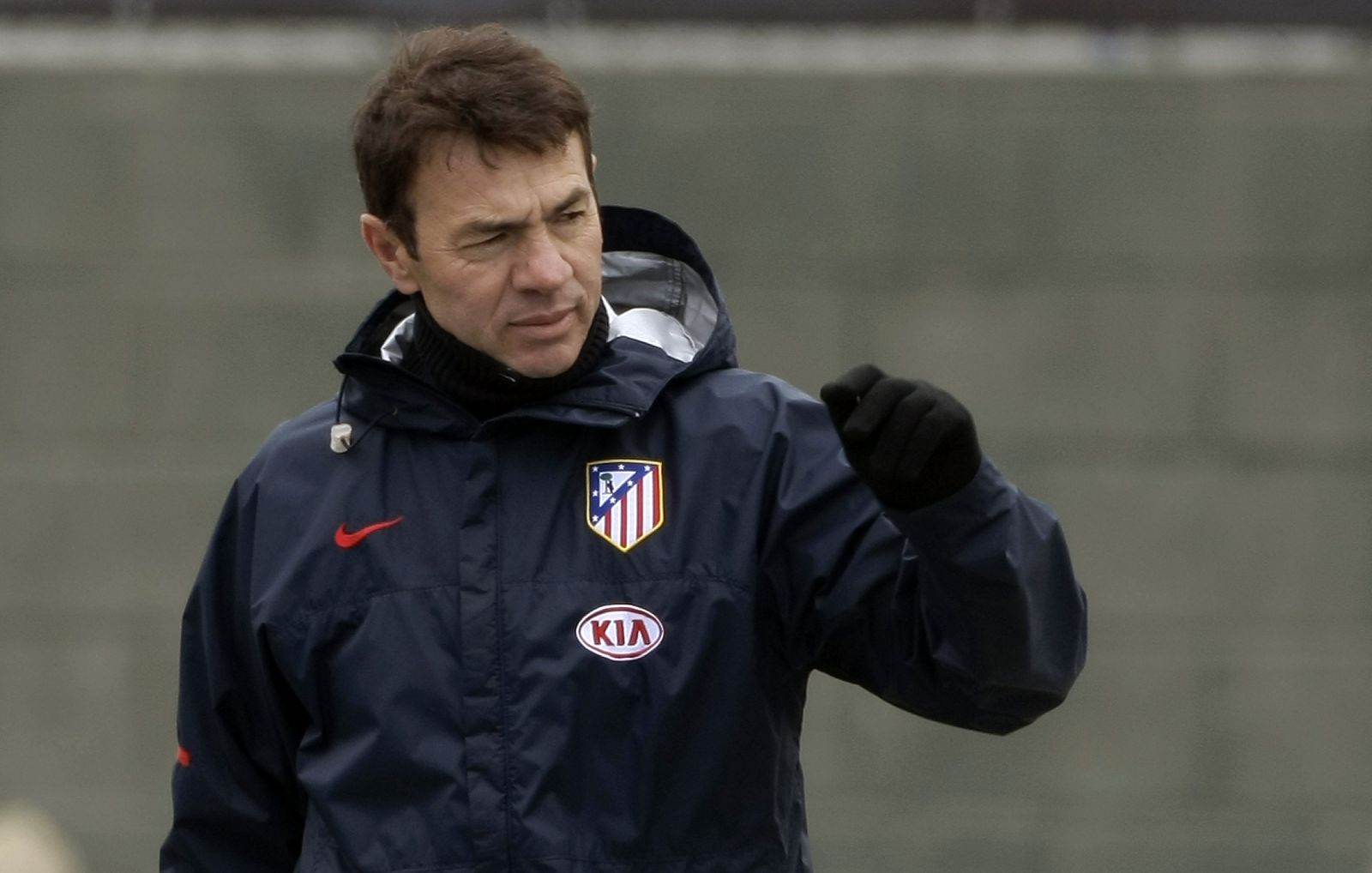 Atletico Madrid's coach Resino gestures as he leaves his team's training session in Majadahonda