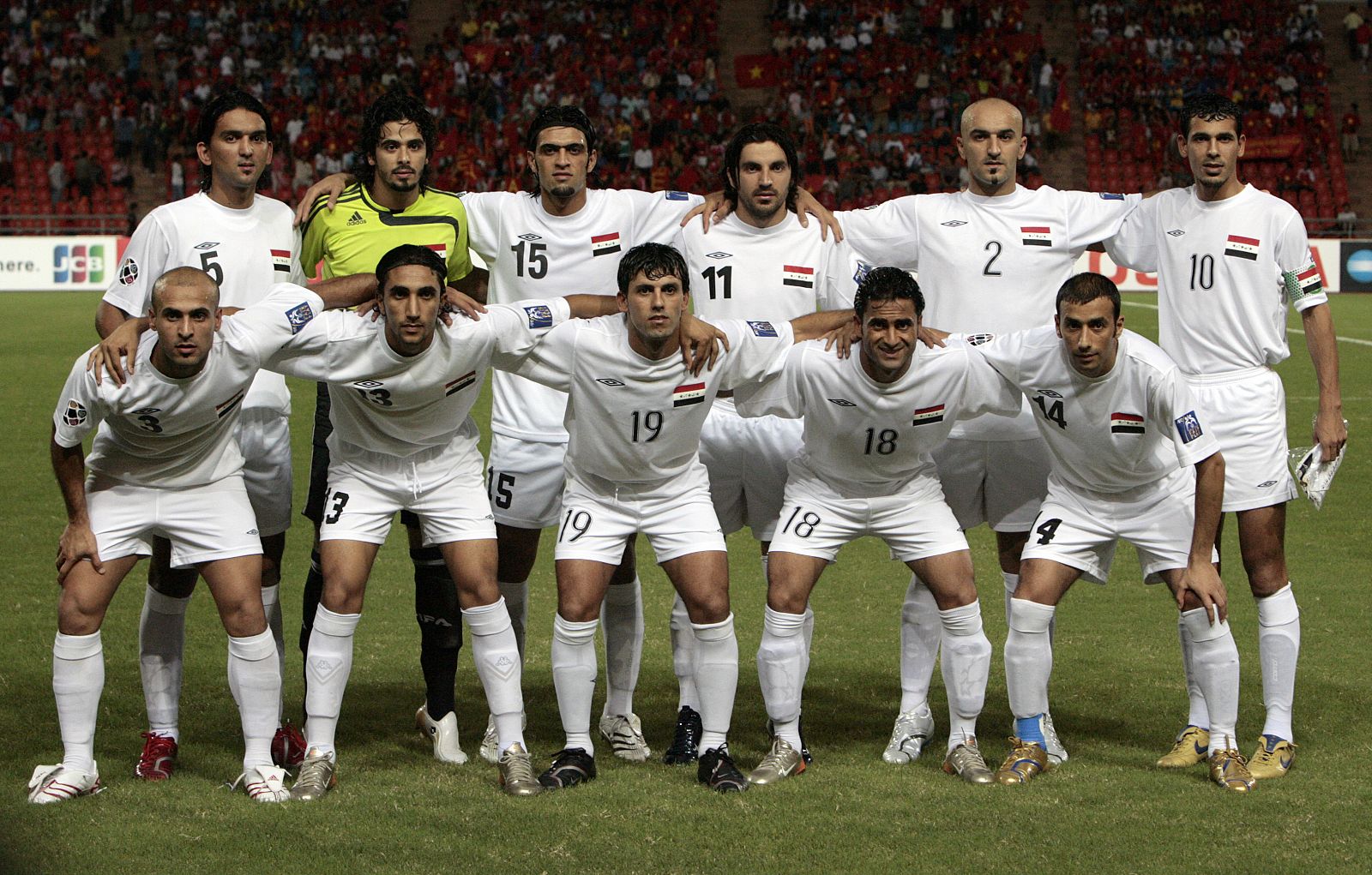 Iraq's national soccer team lines up for a group photo before their 2007 AFC Asian Cup quarter final match against Vietnam at Rajamangala Stadium in Bangkok