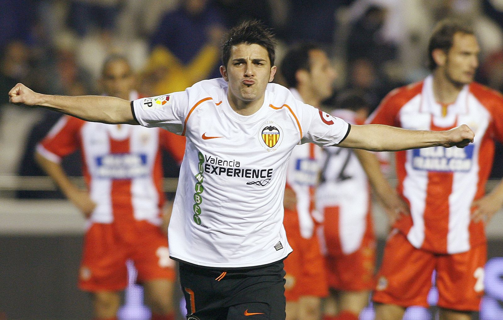 Valencia's Villa celebrates after scoring against Almeria during their Spanish first division soccer match at the Mestalla Stadium in Valencia