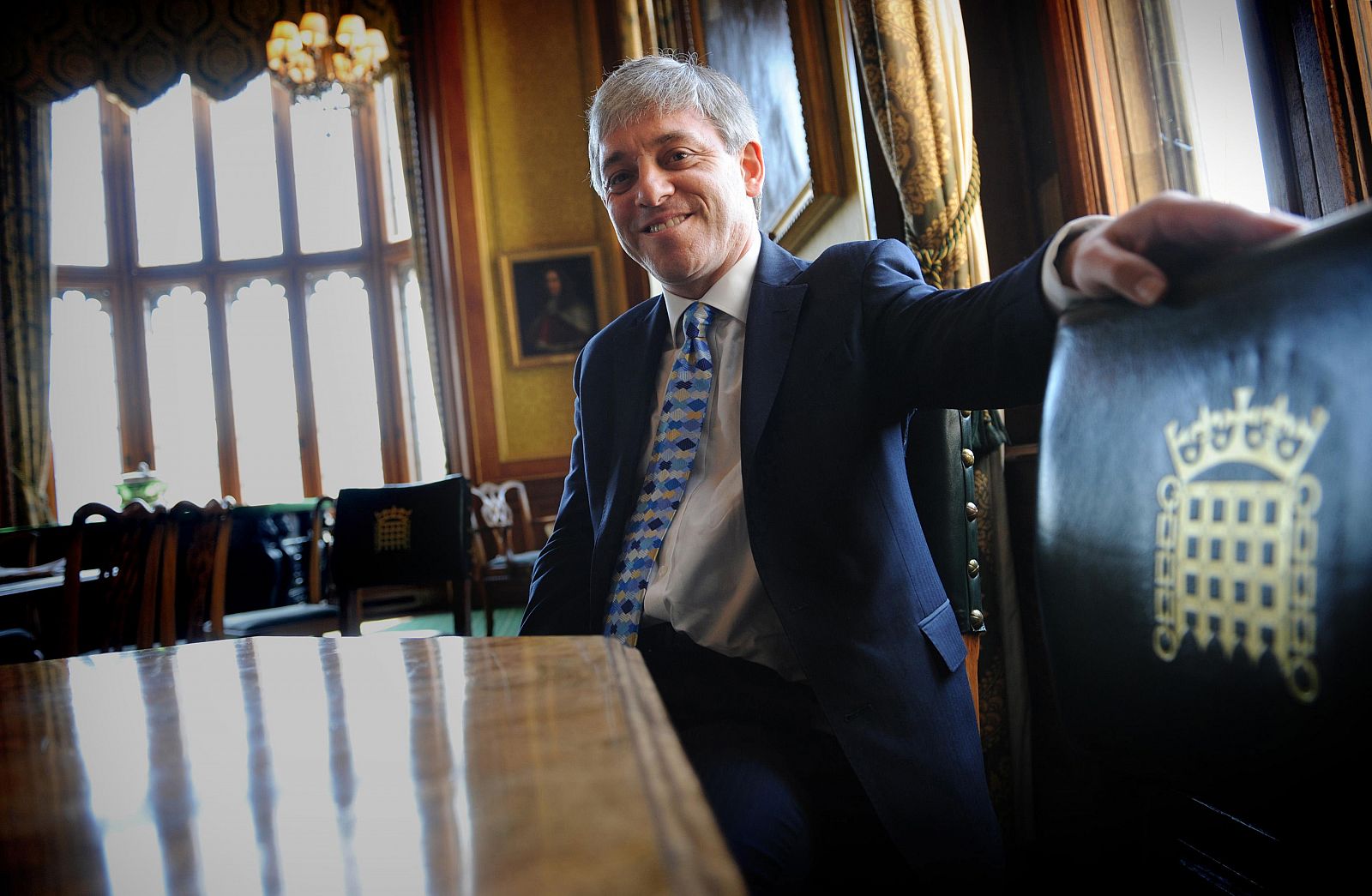 Britain's new Commons Speaker, John Bercow, poses in his office at the House of Commons in Westminster, London