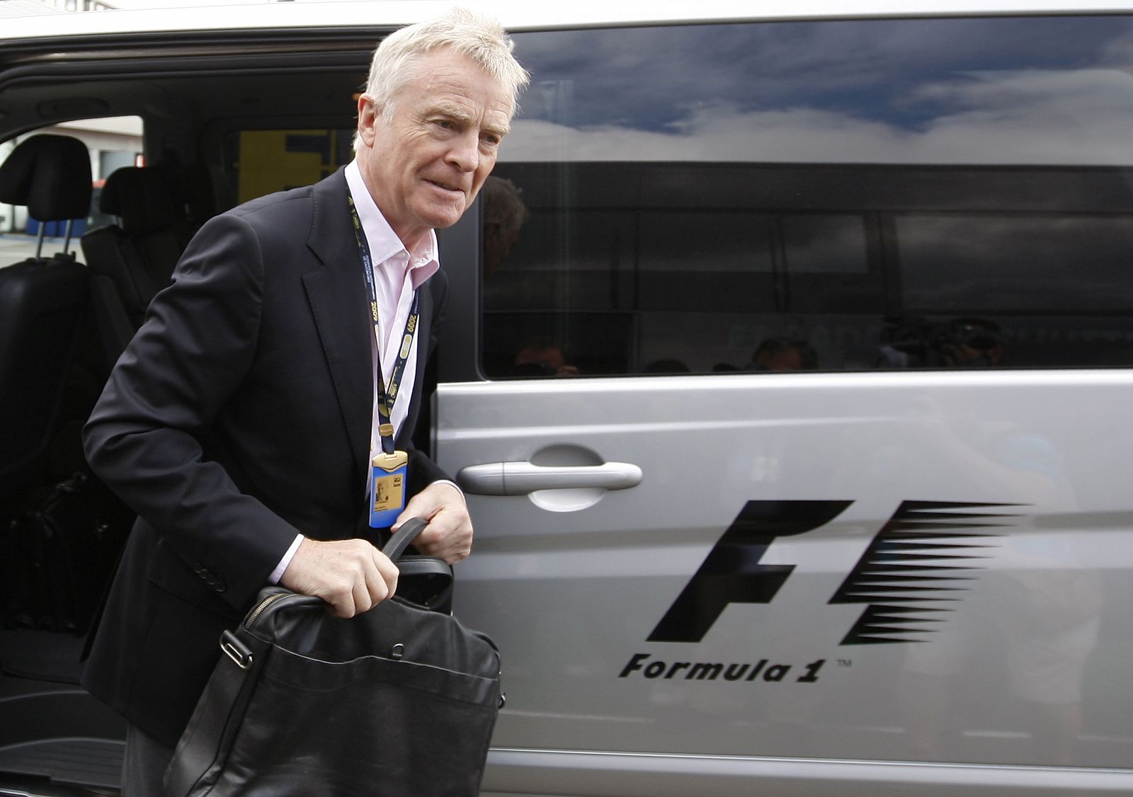 FIA President Max Mosley arrives in the paddock for the British Grand Prix at Silverstone