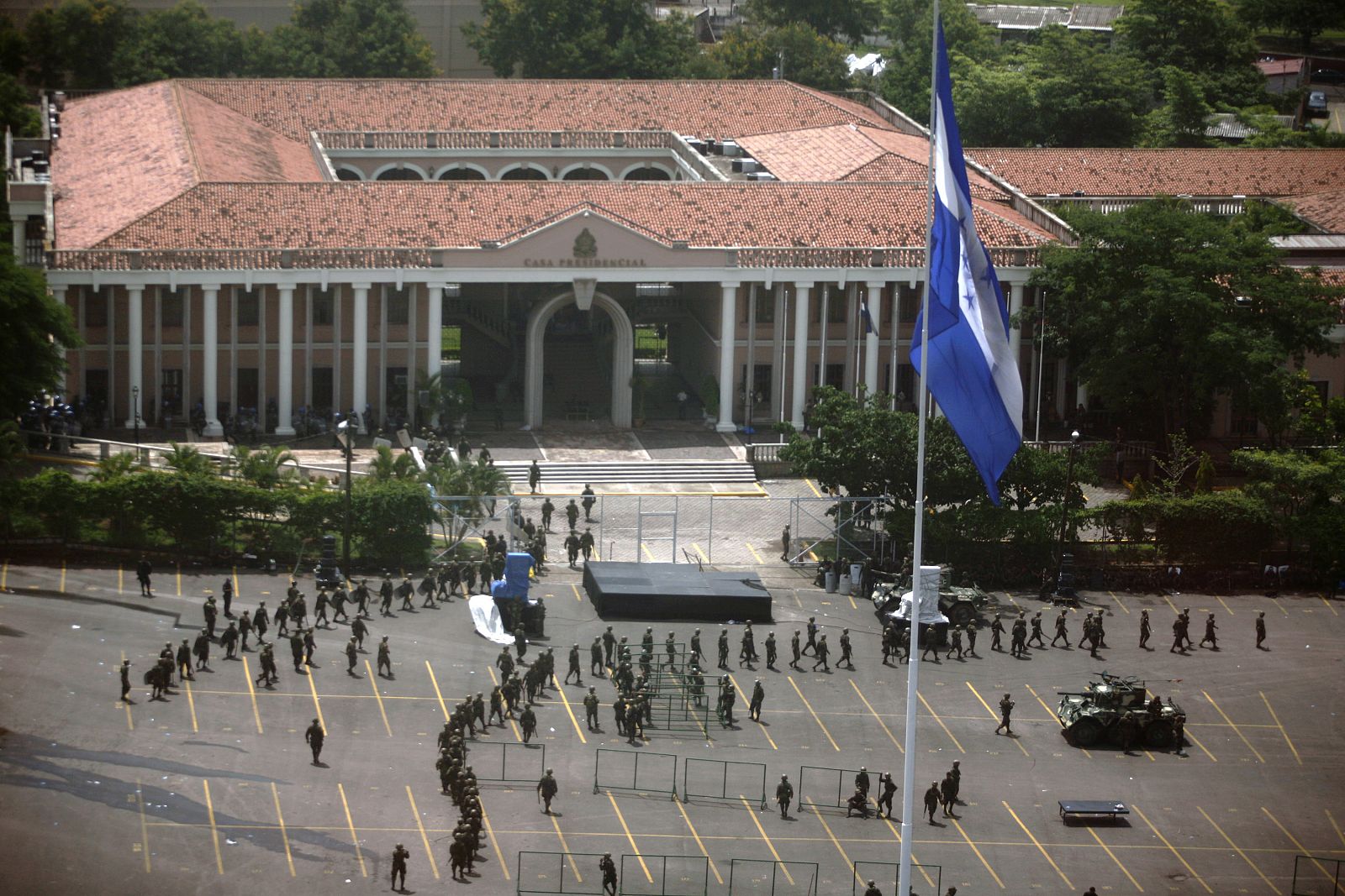 Soldiers walk in front of Presidential residence in Tegucigalpa