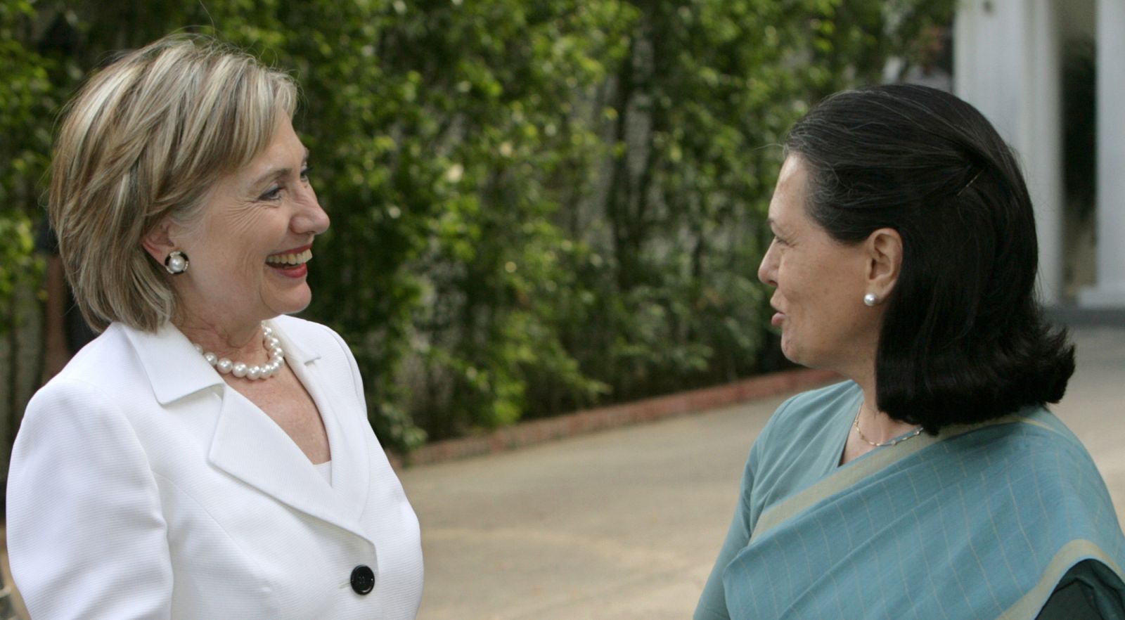 Chief of India's ruling Congress party Sonia Gandhi speaks with U.S. Secretary of State Hillary Clinton before their meeting in New Delhi
