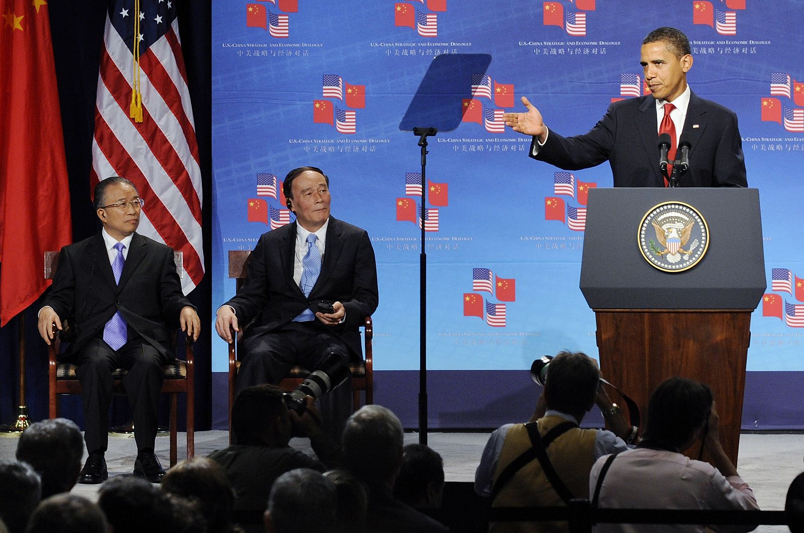 China's State Councillor Dai and China's Vice Premier Wang listen as U.S. President Obama speaks in Washington