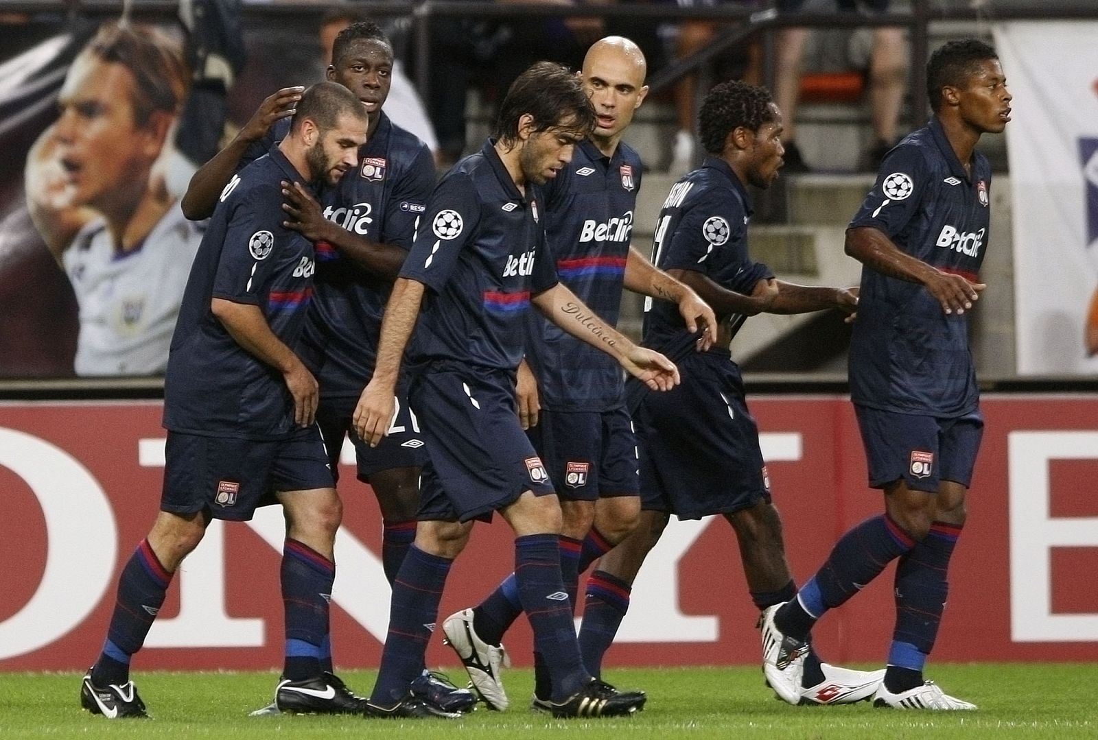 Olympique Lyon's Lisandro celebrates after scoring against Anderlecht during their Champions League soccer match in Brussels