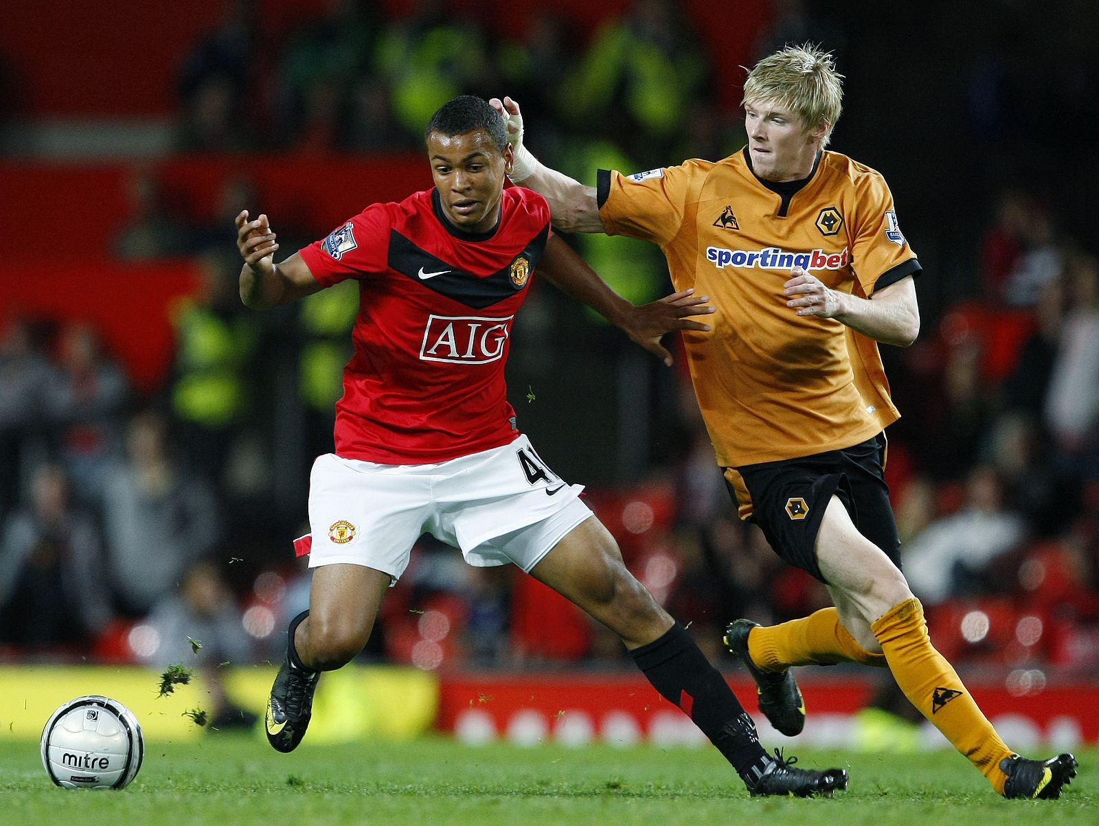 Manchester United's King challenges Wolverhampton Wanderers' Keogh during their English League Cup soccer match in Manchester