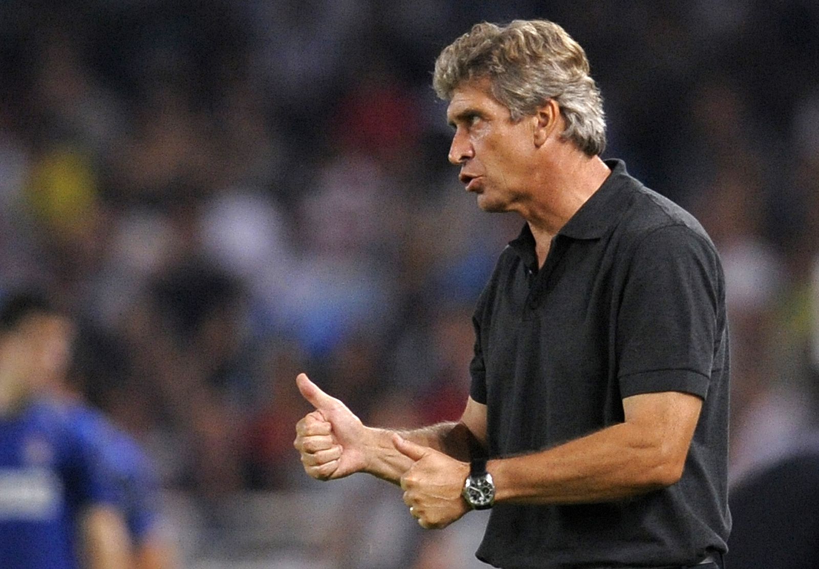 Real Madrid's coach Manuel Pellegrini gestures during their friendly soccer match against Real Sociedad  in San Sebastian