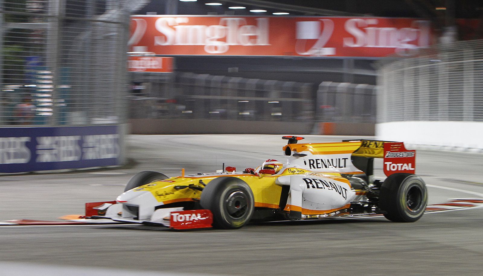 Renault Formula One driver Alonso of Spain negotiates turn 16 during first practice session of Singapore F1 Grand Prix at the Marina Bay street circuit