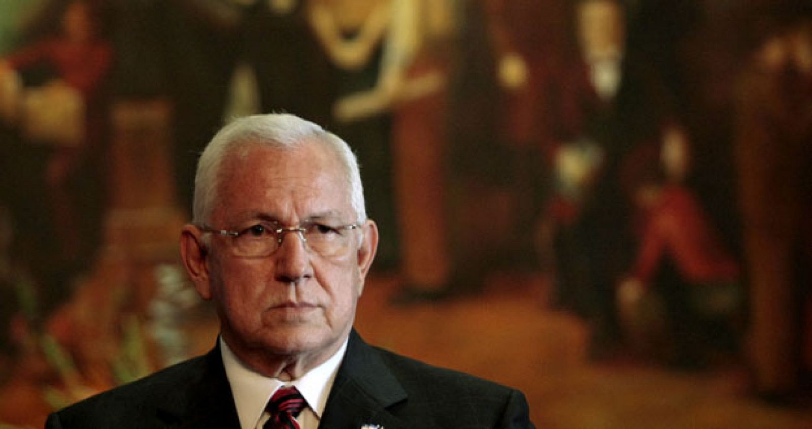 Honduras' interim President Roberto Micheletti listens to a journalist's question during a news conference at the Presidential House in Tegucigalpa