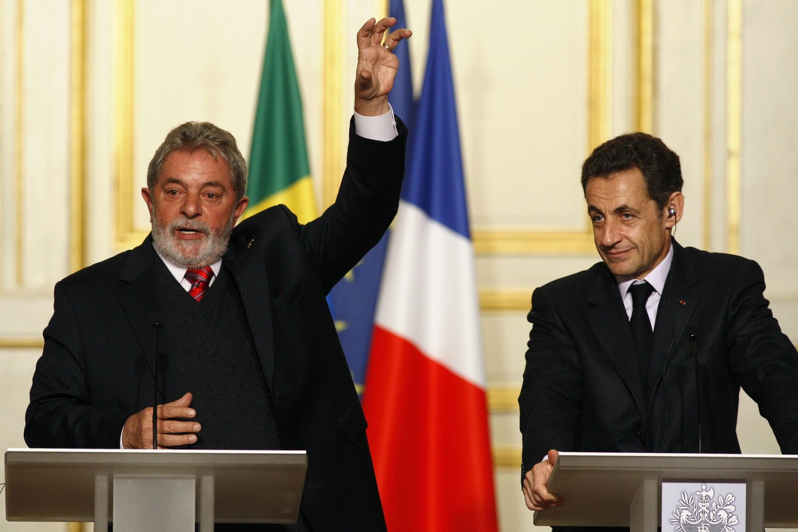 Brazil's President Luiz Inacio Lula da Silva speaks next to France's President Nicolas Sarkozy during a joint news conference at the Elysee Palace in Paris