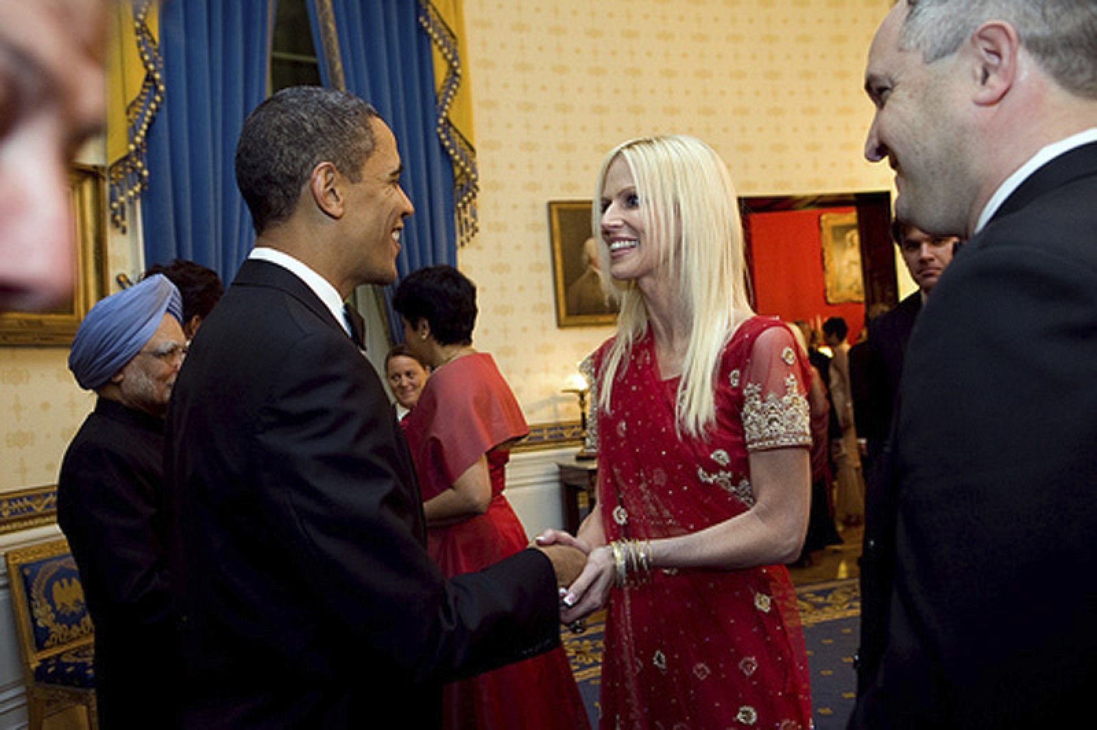 US President Obama greets Michaele Salahi and her husband Tareq during a state dinner for India's Prime Minister Singh at the White House