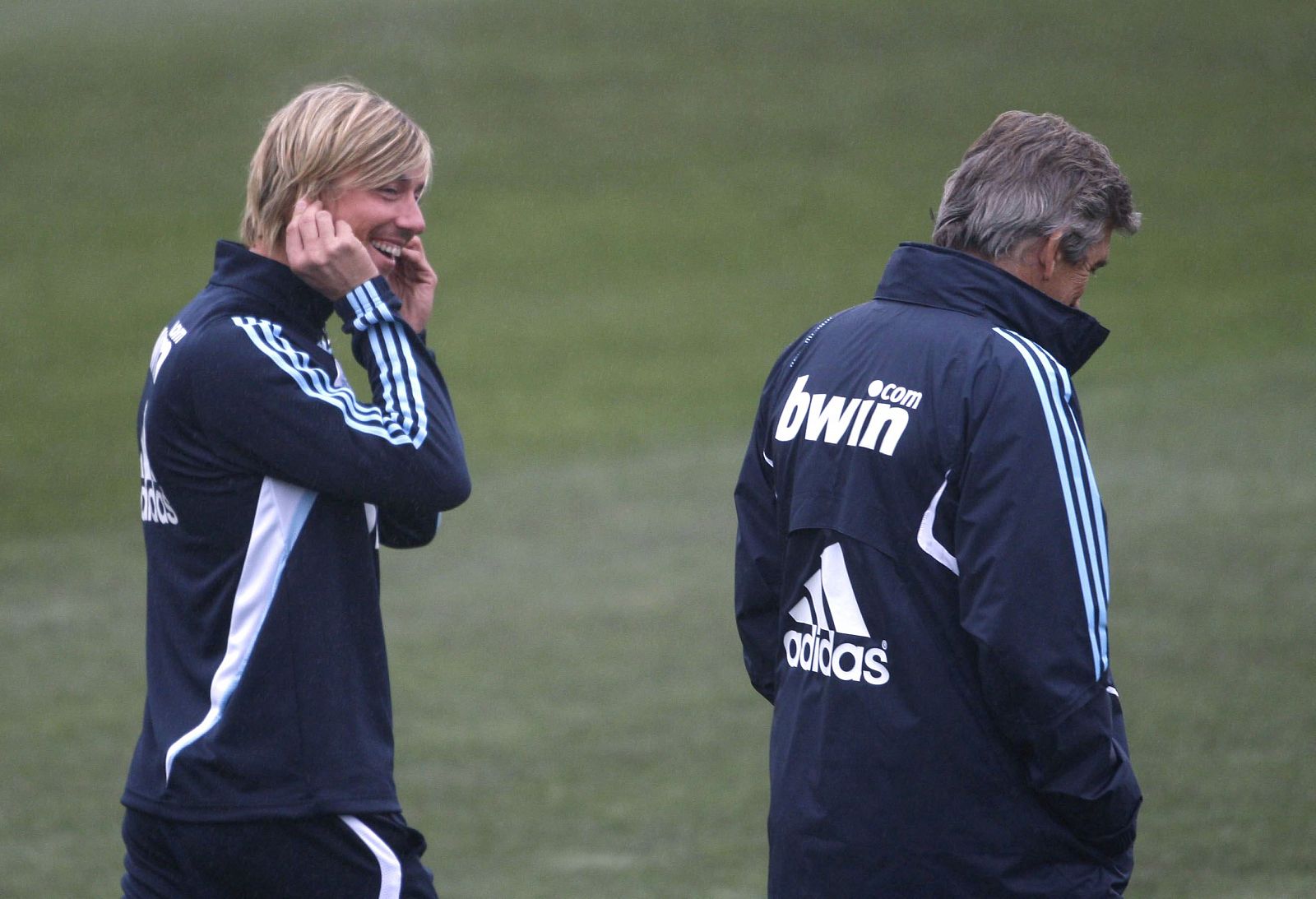 Guti y Pellegrini sonríen durante un entrenamiento.