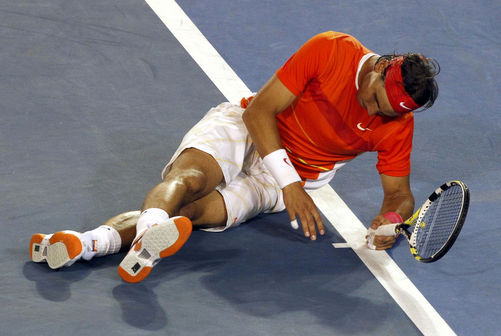 Nadal slips on the court during his quarter-final match against Murray at the Australian Open tennis tournament in Melbourne
