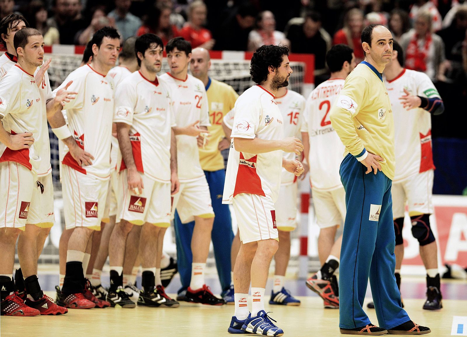 Members of Spain's handball team react after losing to Denmark in their fifth and sixth placing match at men's European Handball Federation Championship in Vienna